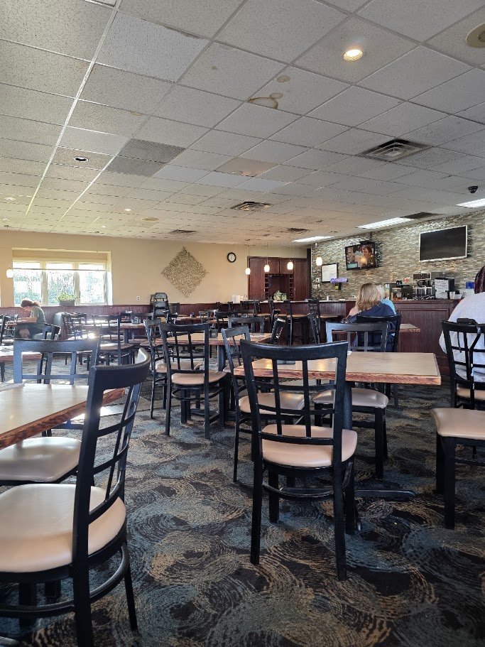 Greek restaurant interior with warm, relaxed seating.